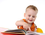 Baby boy studies to read Royalty Free Stock Photo