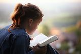 Reading the bible Stock Images