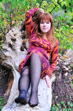 Redheaded girl resting in forest Stock Photos