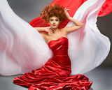 Beauty redheaded girl in fashion dress Royalty Free Stock Image
