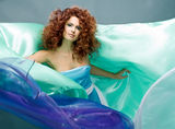 Beauty redheaded girl in fashion dress Royalty Free Stock Photos