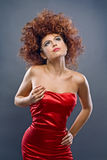 Beauty redheaded girl in fashion dress Stock Image
