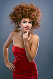 Beauty redheaded girl in fashion dress Royalty Free Stock Photo