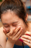 Laughing Asian woman Royalty Free Stock Images