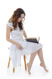 Young girl reading book Stock Photography