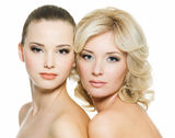 Beautiful sexy young adult women posing on white Royalty Free Stock Photos