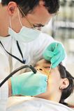 Little girl at a dentist examination Royalty Free Stock Image