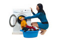 Housewife loading washing machine Stock Image