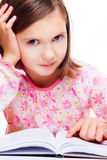 Young girl reading a book Stock Images