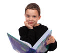 Boy holding a textbook Stock Image