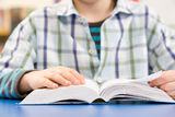Close Up Of Schoolboy Studying Textbook Royalty Free Stock Images