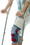 Teenager on crutches Stock Photos