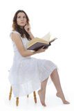 Young girl reading book Stock Image