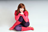 Redheaded sitiing girl Stock Photos