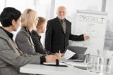 Senior businessman training colleagues Stock Photo