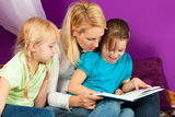 Mother is reading a book Stock Photography