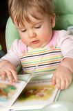 Baby girl with book Royalty Free Stock Photo