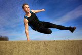 Jump over wall Stock Image