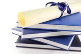 Diploma and books Royalty Free Stock Photography