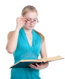 A young girl in glasses with a book Stock Photos