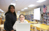 Teacher and Student in Library Stock Image