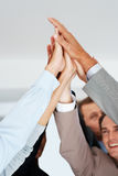 Business team celebrating success with high five Royalty Free Stock Image