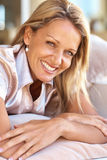 Closeup of a happy mid adult woman relaxing Stock Photos