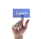 Hand pushing the learn button Stock Photo