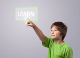 Kid touching LEARN button Royalty Free Stock Images