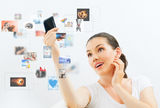 Girl holding phone Stock Images