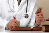 Writing prescription or medical examination notes Stock Images