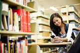 Asian student texting Royalty Free Stock Photos