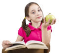 Young girl with book and apple Royalty Free Stock Photos