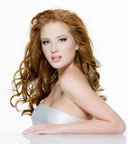 Beautiful red-haired woman with long  wavy hairs Royalty Free Stock Photography