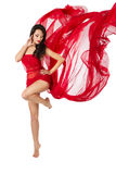 Woman dancing in red flying dress. Over white Royalty Free Stock Photo