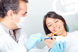 Dentist teaching to brush teeth Royalty Free Stock Photo