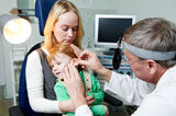 Medical otitus examination of child doctor Royalty Free Stock Image
