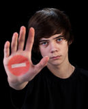 Come no further - teenager boy with sign on hand Stock Images