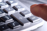 Finger over Calculator Keypad Plus and Equal Signs Royalty Free Stock Photos