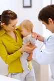 Scared baby on examination Royalty Free Stock Photos