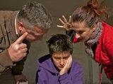 Upset teenager and family Stock Image