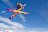 Young skier jumping Stock Photo