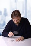 Man studies the financial report Stock Photography