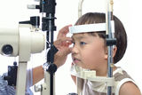 Boy eye examination Stock Photography