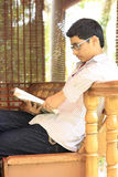 Indian College Student Reading Textbook Royalty Free Stock Photo
