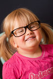 Young girl with adult glasses Royalty Free Stock Photos