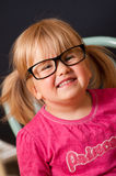 Girl in adult glasses Stock Photography