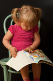 Little girl with book Royalty Free Stock Images