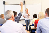 Senior tutor teaching class Stock Photography