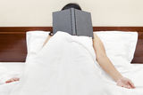 Tired woman after read a book Royalty Free Stock Image